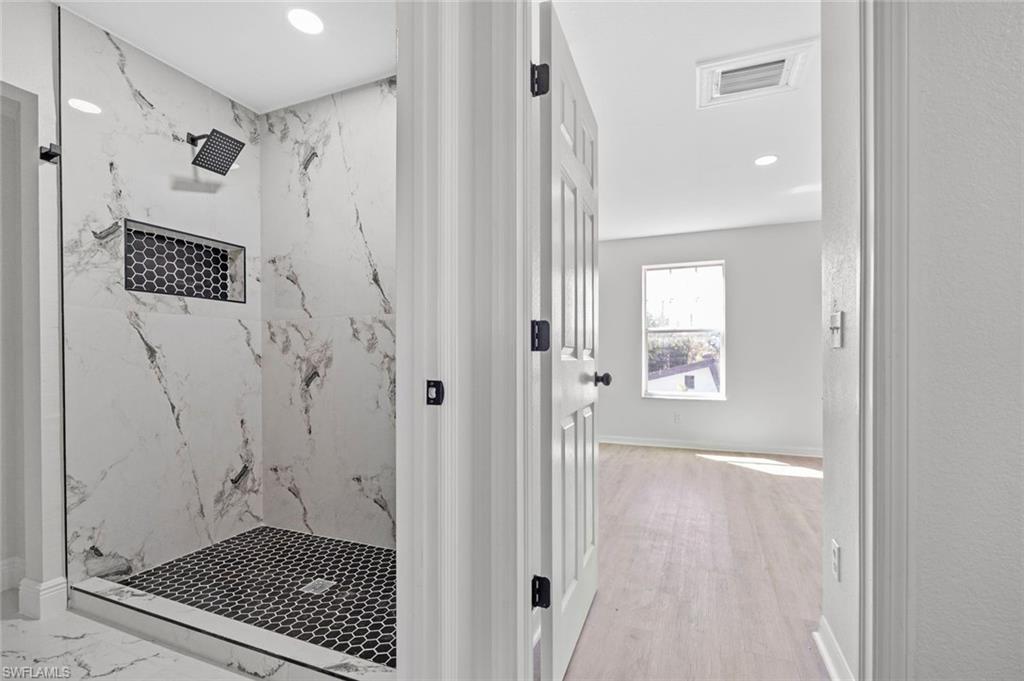 Undisclosed Address Naples, FL 34113 - Photo 11 of 21 a bathroom with a shower