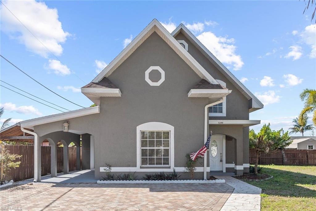 Undisclosed Address Naples, FL 34113 - Photo 20 of 21 a front view of a house with a yard