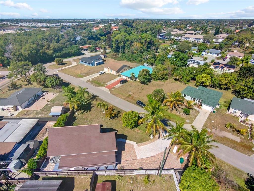 Undisclosed Address Naples, FL 34113 - Photo 2 of 21 an aerial view of residential houses with outdoor space