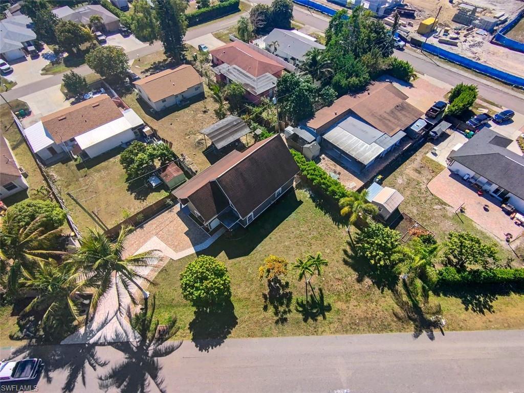 Undisclosed Address Naples, FL 34113 - Photo 3 of 21 an aerial view of a house with a yard