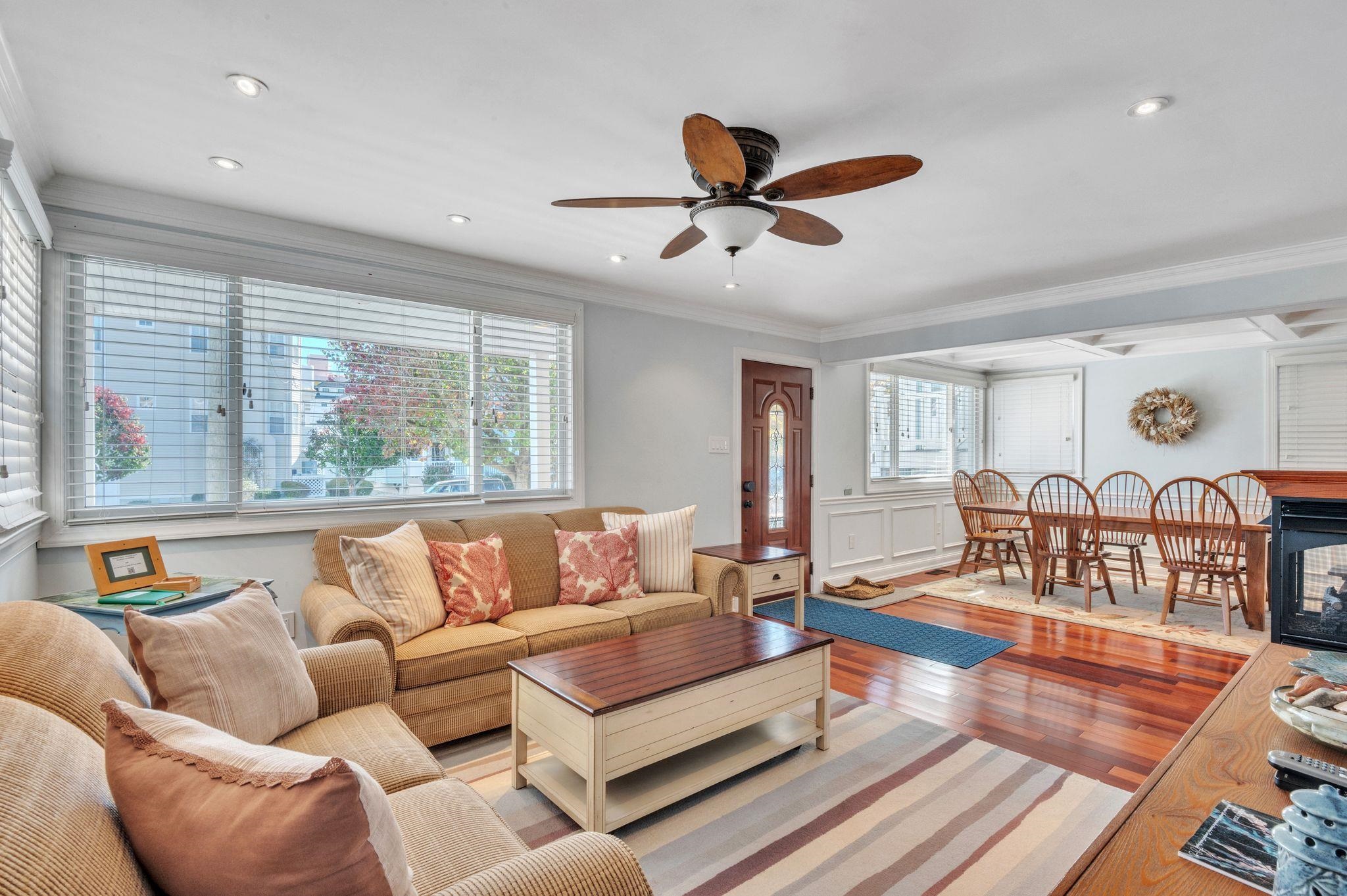1504 Central, Unit 1504 Ocean City, NJ 08330 - Photo 4 of 16 a living room with furniture and a large window