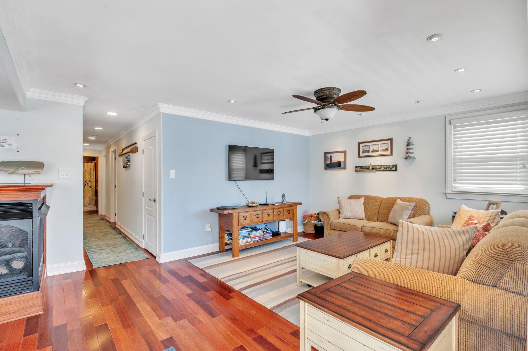 1504 Central, Unit 1504 Ocean City, NJ 08330 - Photo 5 of 16 a living room with furniture and a wooden floor