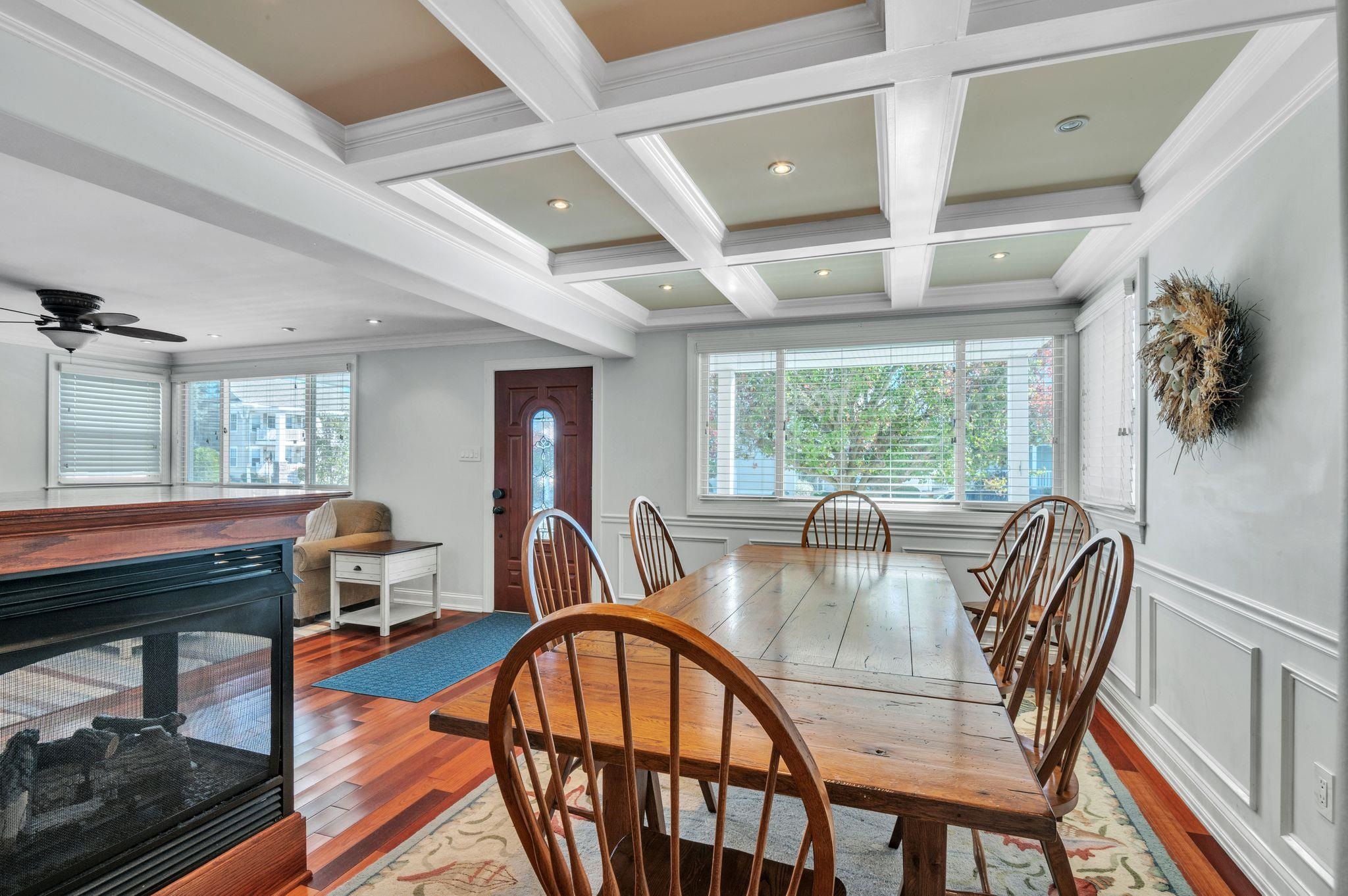 1504 Central, Unit 1504 Ocean City, NJ 08330 - Photo 7 of 16 a dining room with furniture a rug and wooden floor