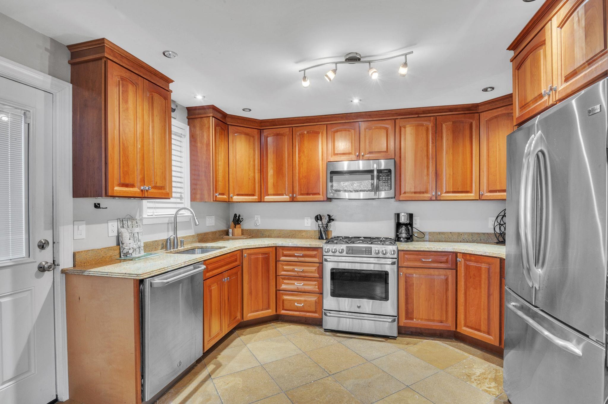 1504 Central, Unit 1504 Ocean City, NJ 08330 - Photo 8 of 16 a kitchen with a sink stove and refrigerator