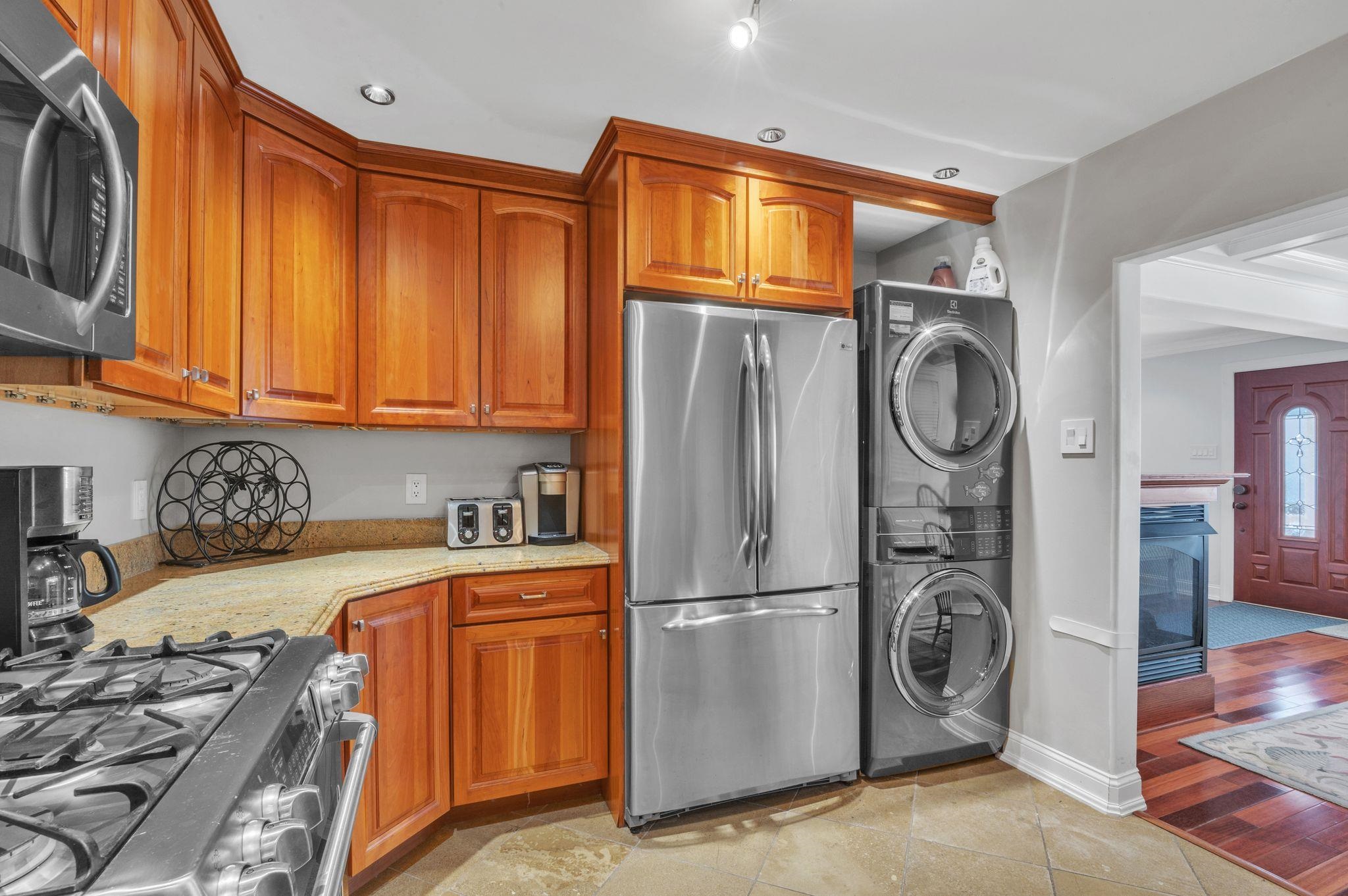 1504 Central, Unit 1504 Ocean City, NJ 08330 - Photo 9 of 16 a kitchen with stainless steel appliances granite countertop a refrigerator and a stove top oven