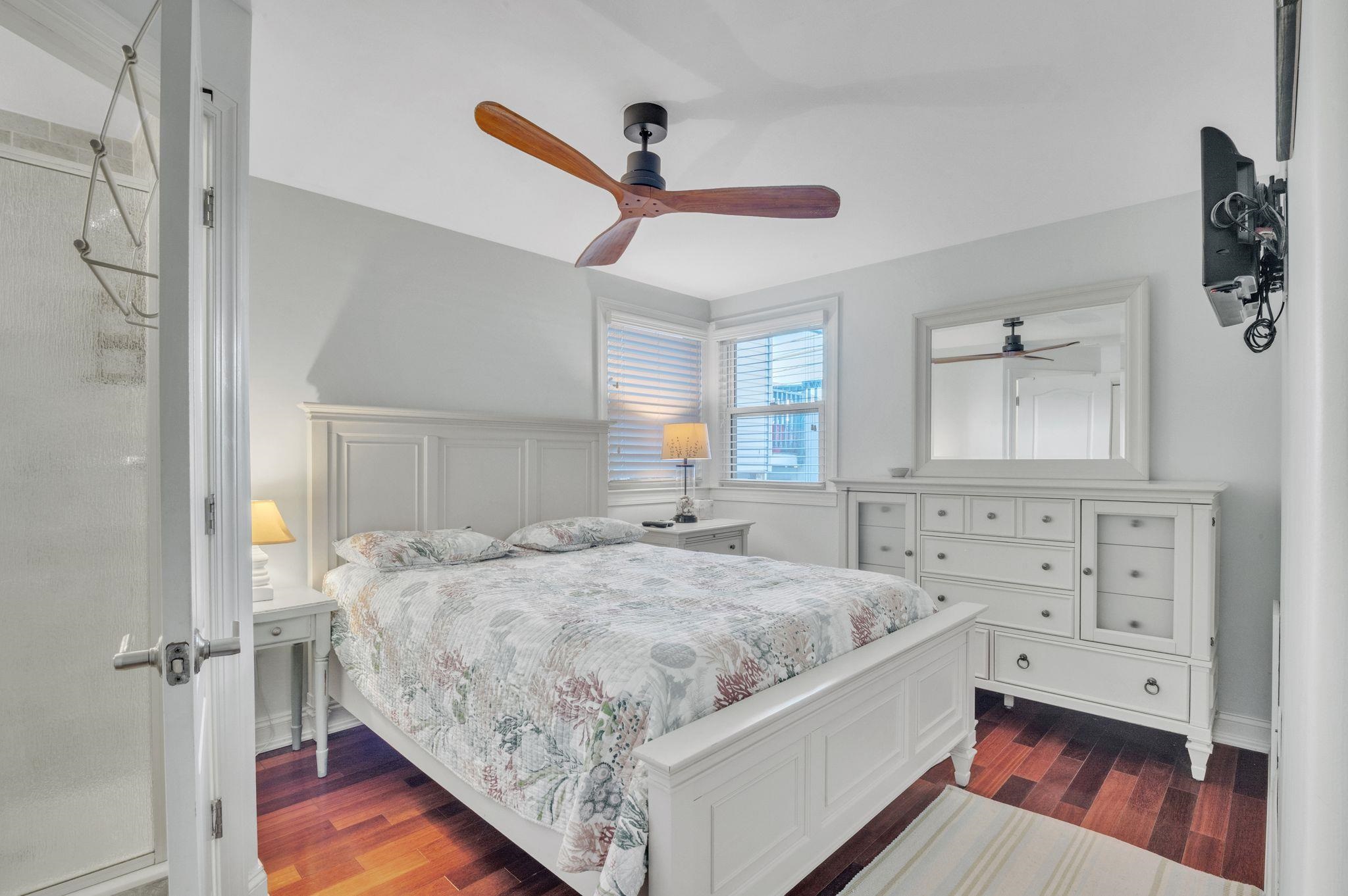 1504 Central, Unit 1504 Ocean City, NJ 08330 - Photo 10 of 16 a spacious bedroom with a bed and a dresser