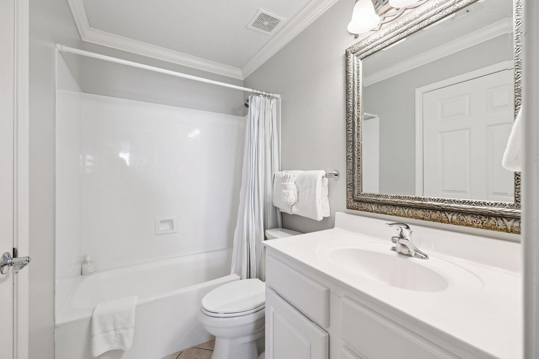 4045 West County Highway 30A, Unit 402 Santa Rosa Beach, FL 32459 - Photo 11 of 20 a bathroom with a sink toilet and shower