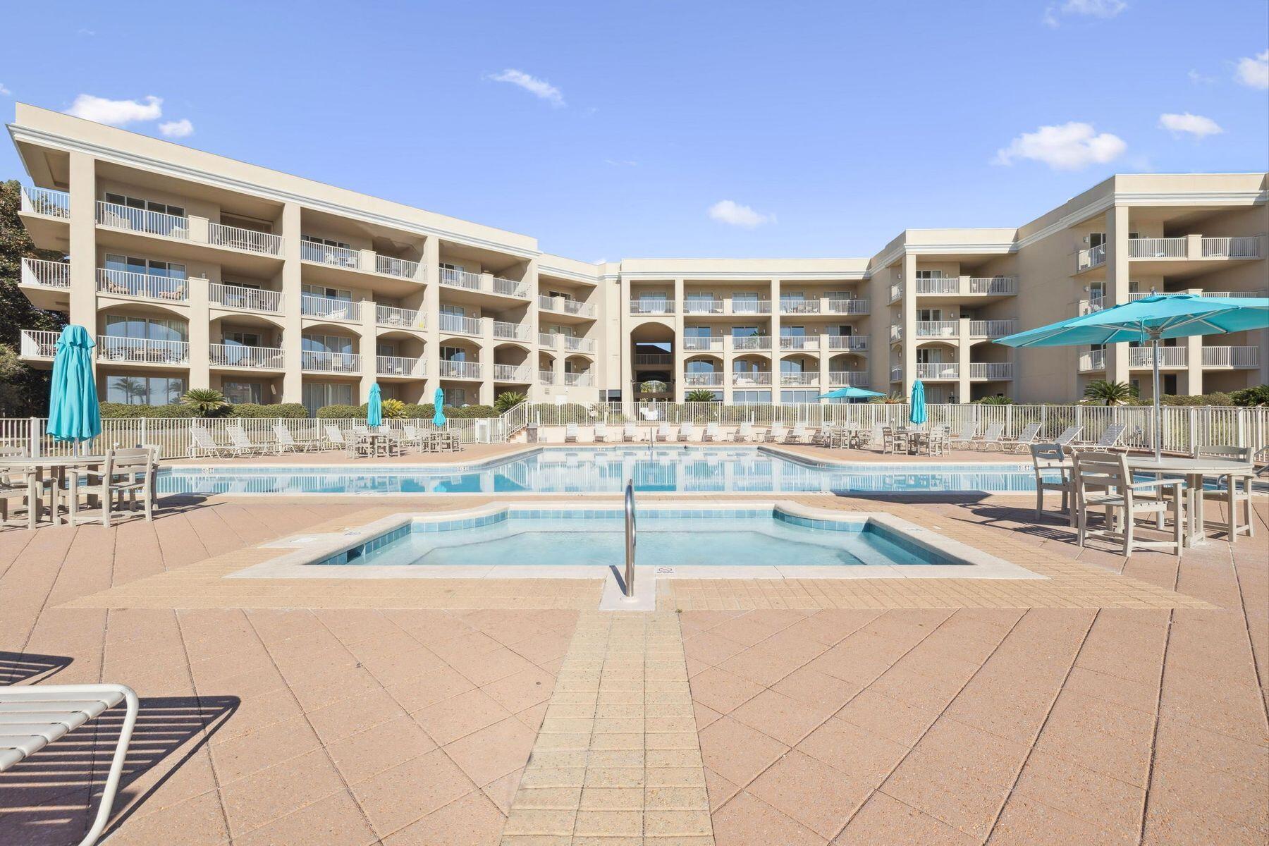 4045 West County Highway 30A, Unit 402 Santa Rosa Beach, FL 32459 - Photo 14 of 20 a view of an outdoor space with swimming pool