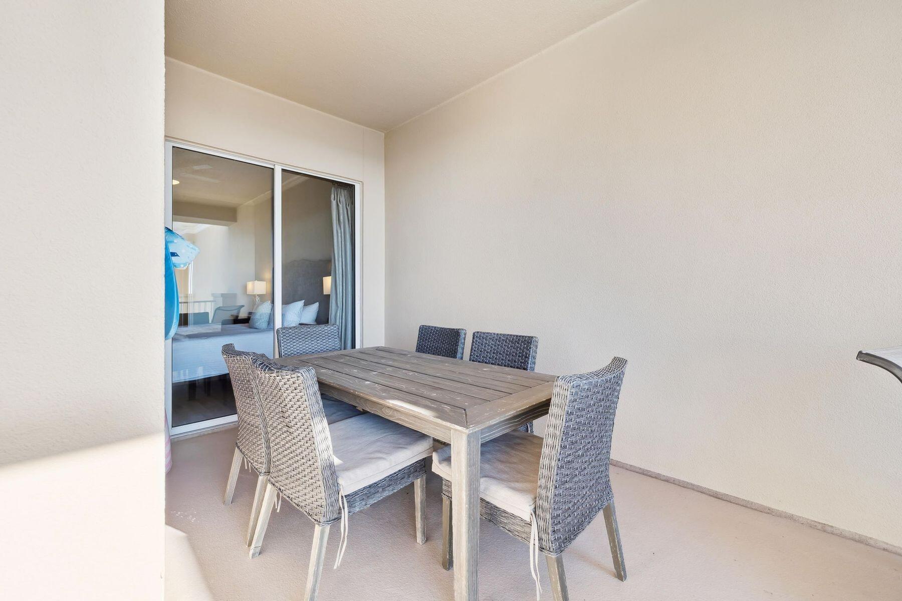 4045 West County Highway 30A, Unit 402 Santa Rosa Beach, FL 32459 - Photo 16 of 20 a dining room with furniture and window