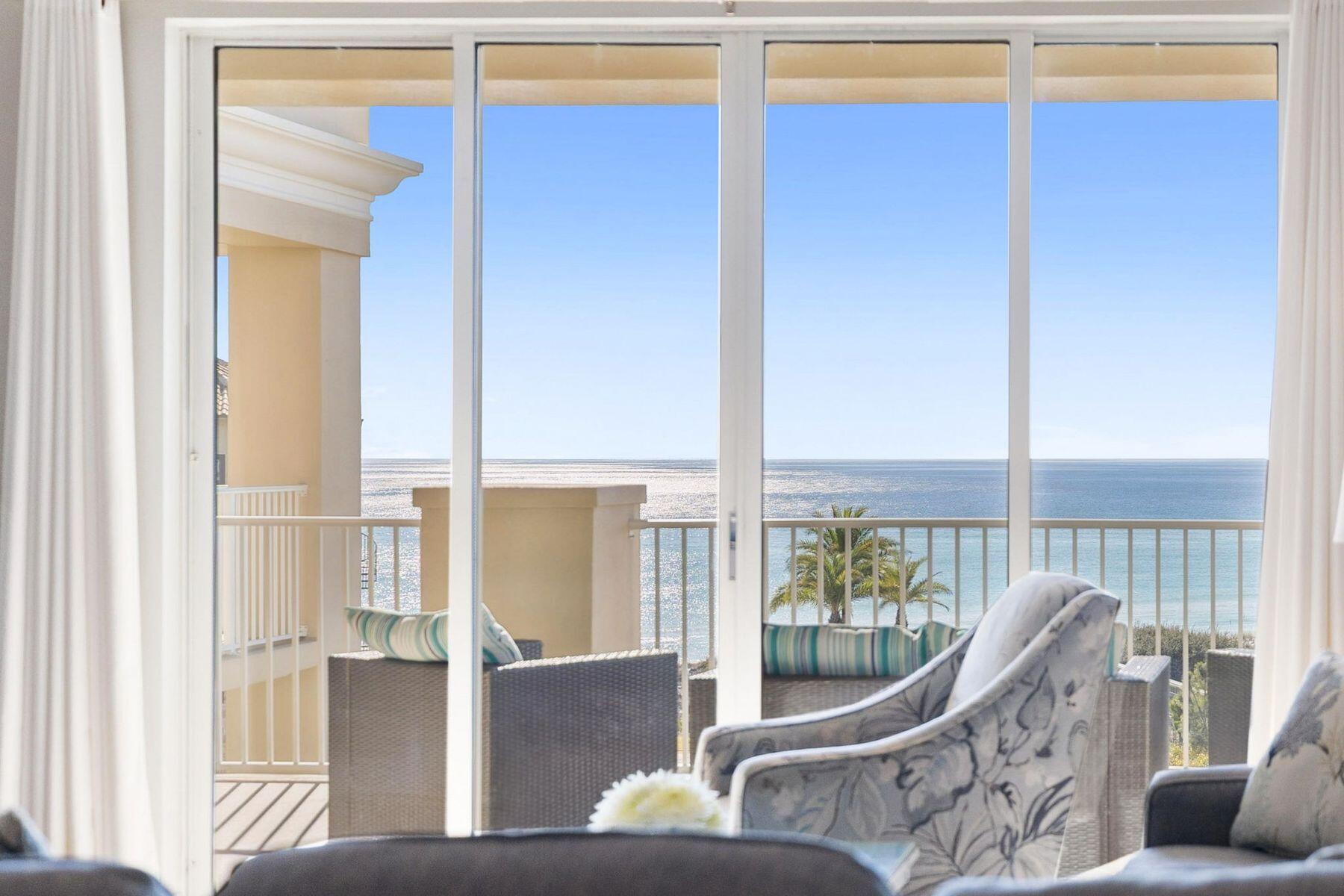 4045 West County Highway 30A, Unit 402 Santa Rosa Beach, FL 32459 - Photo 2 of 20 a living room with furniture and floor to ceiling windows