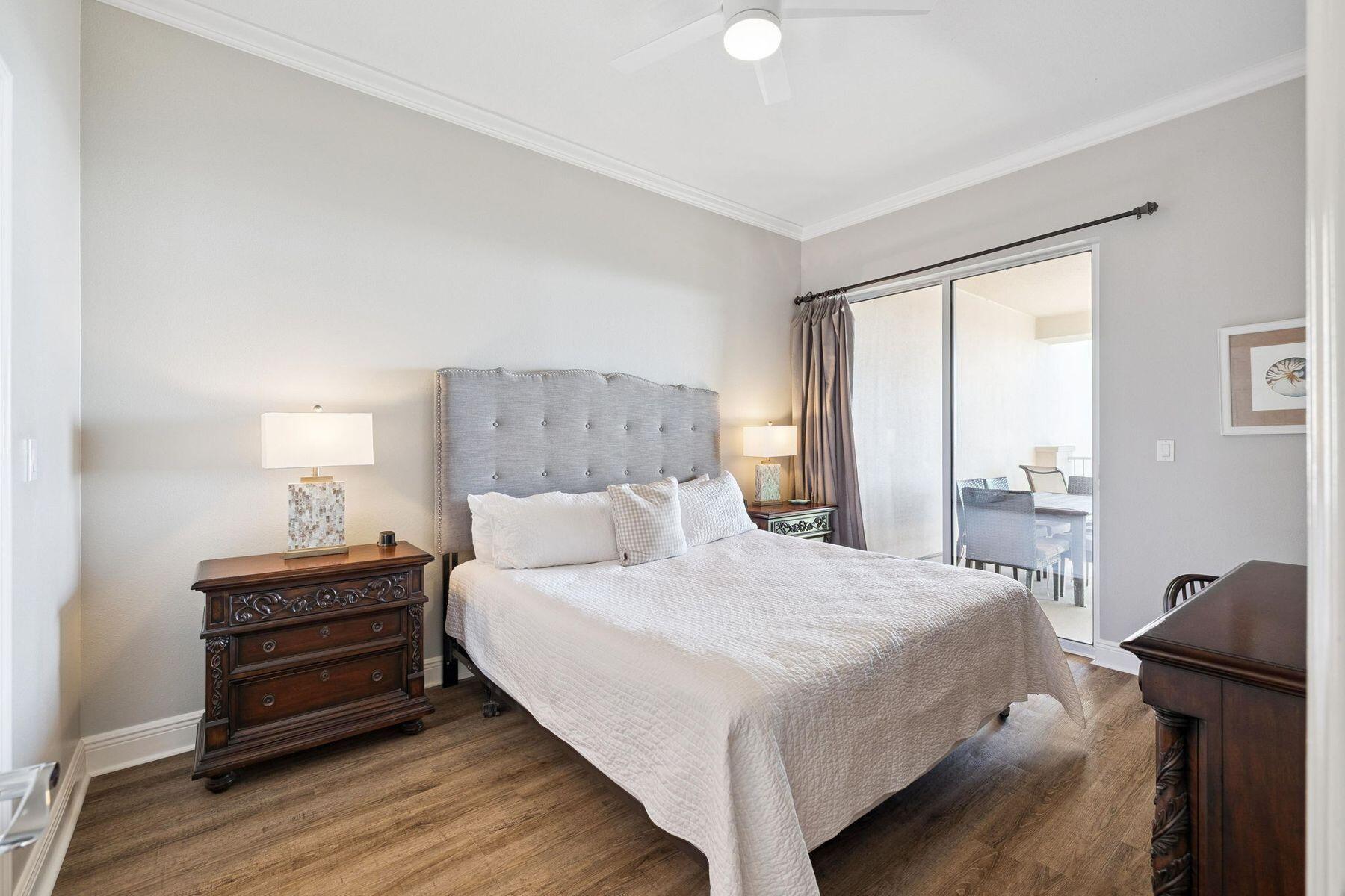 4045 West County Highway 30A, Unit 402 Santa Rosa Beach, FL 32459 - Photo 6 of 20 a bedroom with a bed and wooden floor