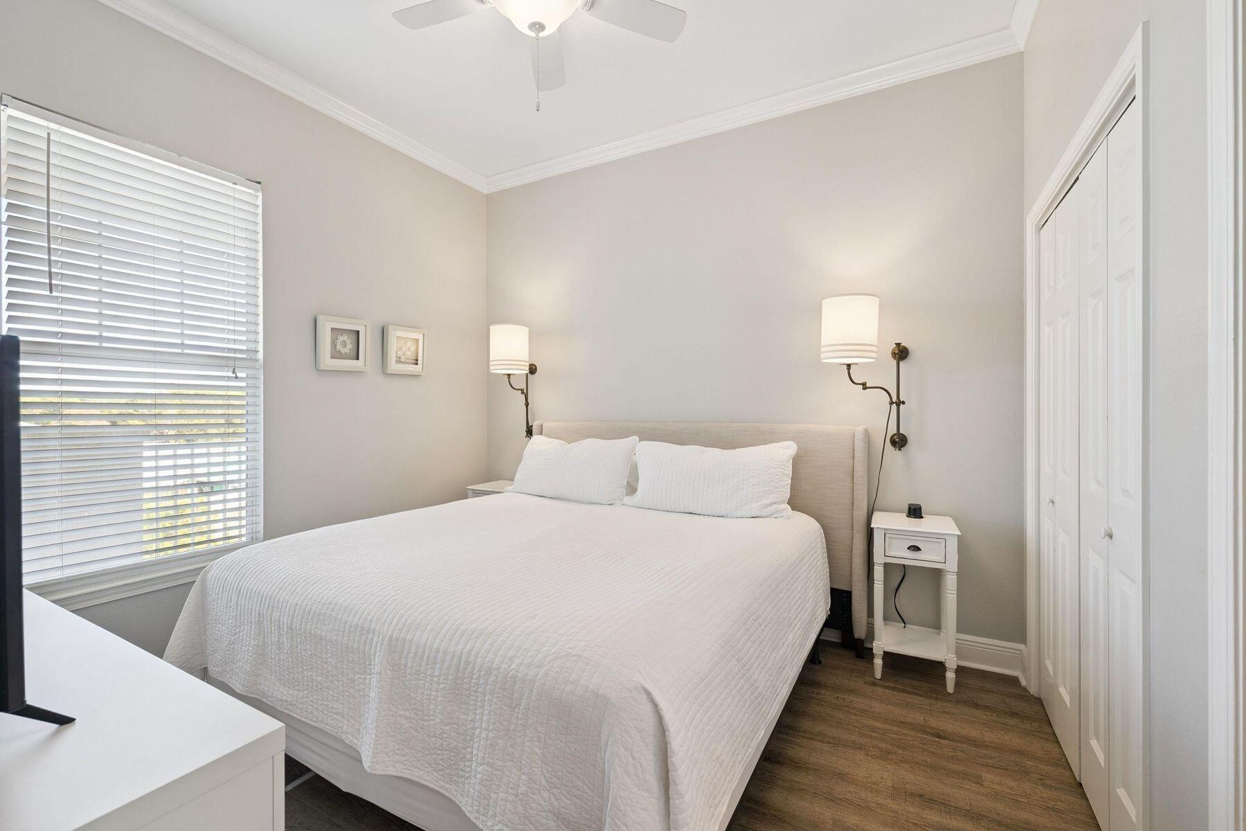 4045 West County Highway 30A, Unit 402 Santa Rosa Beach, FL 32459 - Photo 8 of 20 a bedroom with a bed and a window