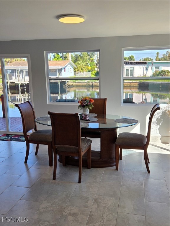 8141 Cleaves Road North Fort Myers, FL 33903 - Photo 13 of 37 a view of a dining room with furniture window and outside view