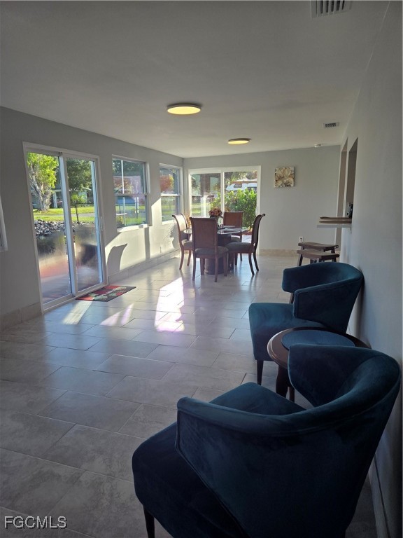 8141 Cleaves Road North Fort Myers, FL 33903 - Photo 14 of 37 a living room with furniture and a large window