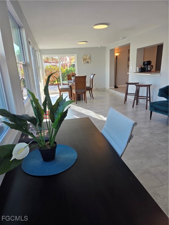 8141 Cleaves Road North Fort Myers, FL 33903 - Photo 15 of 37 a living room with furniture flowerpot and a potted plant