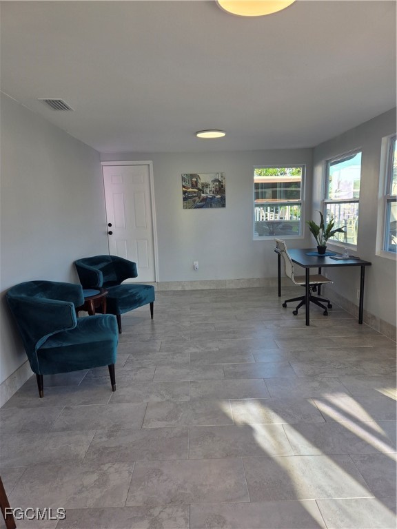 8141 Cleaves Road North Fort Myers, FL 33903 - Photo 16 of 37 a living room with furniture and a window