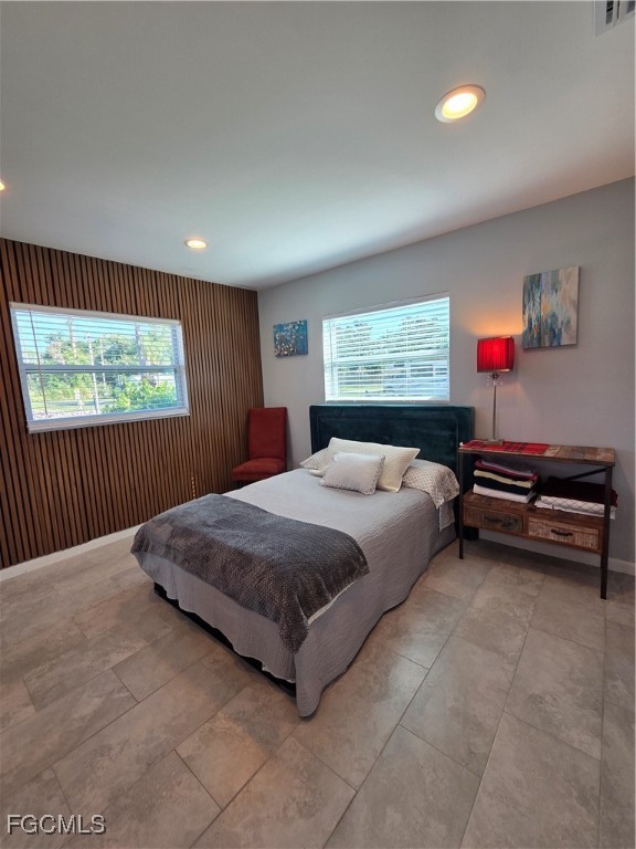 8141 Cleaves Road North Fort Myers, FL 33903 - Photo 21 of 37 a spacious bedroom with a bed and a window