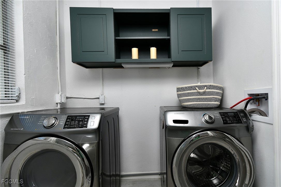 8141 Cleaves Road North Fort Myers, FL 33903 - Photo 23 of 37 a view of washer and dryer in a kitchen