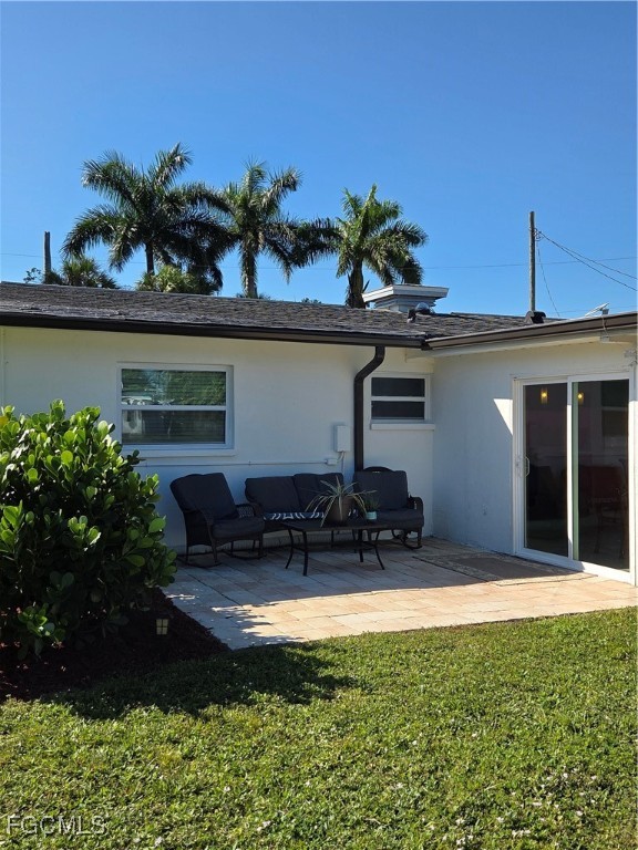8141 Cleaves Road North Fort Myers, FL 33903 - Photo 26 of 37 a front view of a house with a yard and a bench