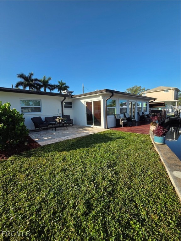 8141 Cleaves Road North Fort Myers, FL 33903 - Photo 27 of 37 a view of a house with a yard patio and sitting area
