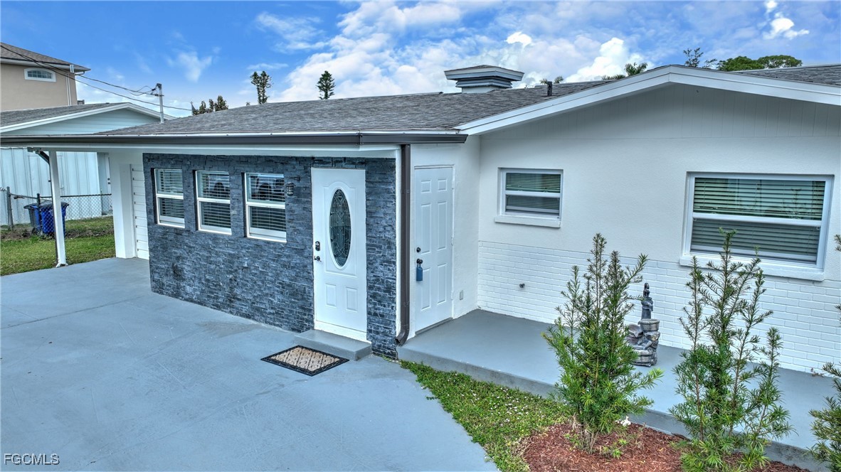 8141 Cleaves Road North Fort Myers, FL 33903 - Photo 33 of 37 front view of a house with a yard