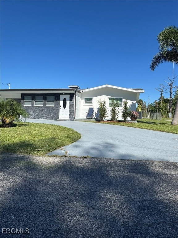 8141 Cleaves Road North Fort Myers, FL 33903 - Photo 36 of 37 a view of big yard with front of house