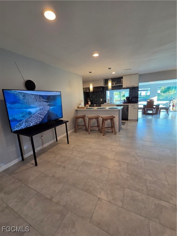 8141 Cleaves Road North Fort Myers, FL 33903 - Photo 7 of 37 a living room with furniture and a table