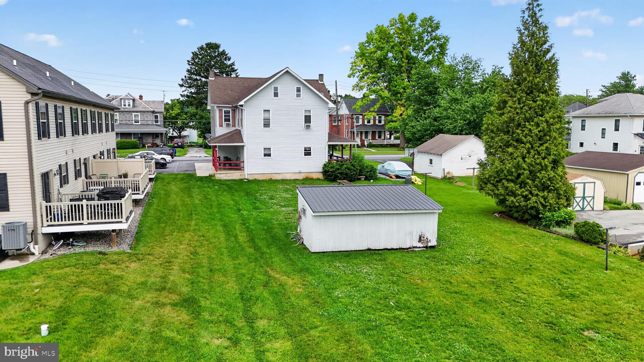 14 North Kinzer Road Kinzers, PA 17535 - Photo 28 of 34 Spacious backyard with lush greenery.