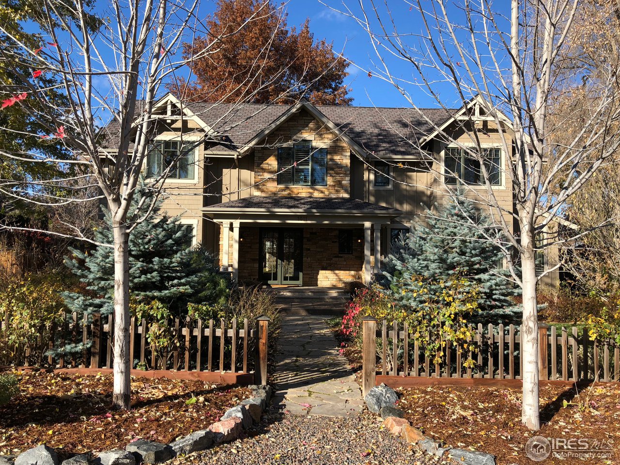 a view of a house with large tree