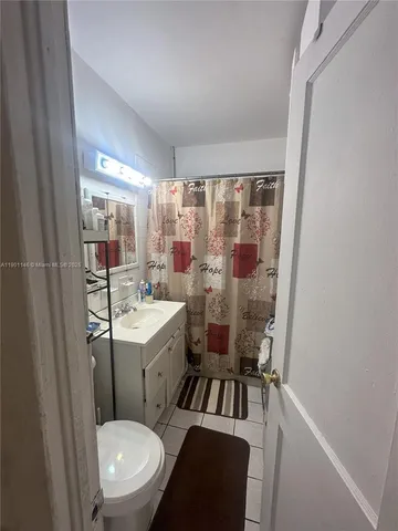 a picture of a living room with a fireplace