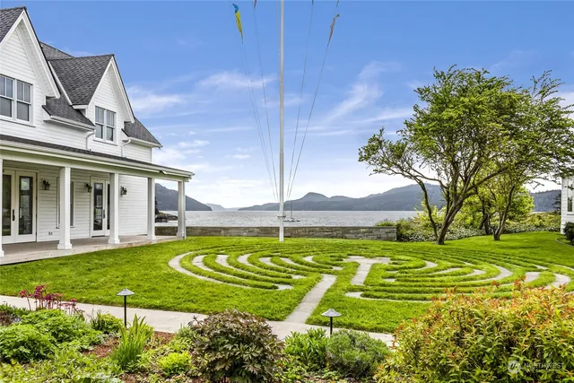 a view of a lush green hillside and houses