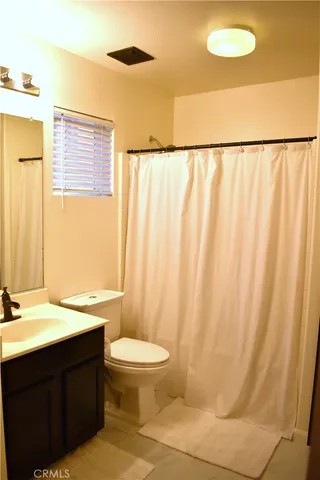 a view of a bathroom from a hallway
