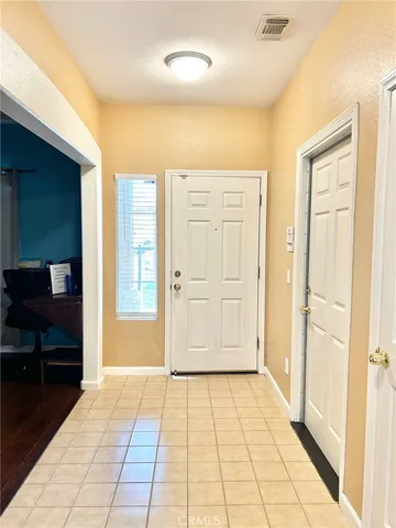 a view of a entryway door with interior of the house