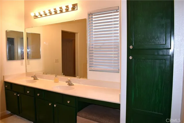 a room with a dresser and a window