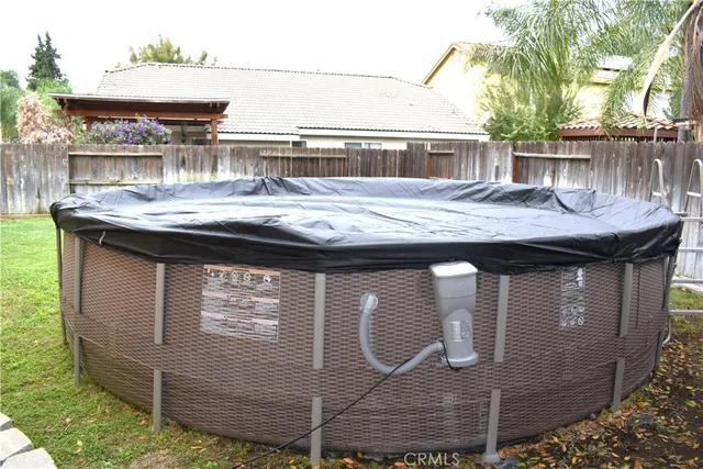 a view of a wooden floor and a yard in the back
