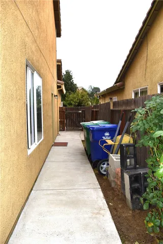 an aerial view of a house with garden space and street view