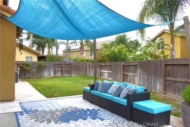 a view of a backyard with a garden and deck