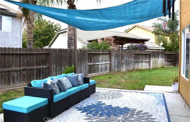 a room with furniture and flat screen tv