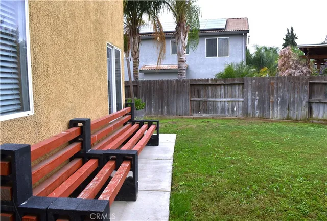 an aerial view of a house with garden space and street view