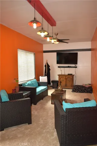 an aerial view of a house with garden space and street view