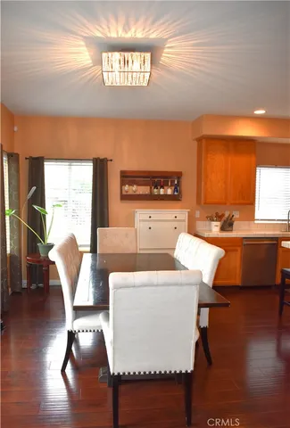 a kitchen with stainless steel appliances a stove a sink dishwasher and a refrigerator