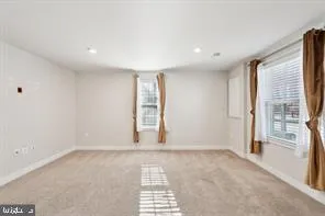 a view of an empty room and a window