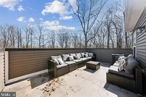 a outdoor living space with furniture and a fireplace