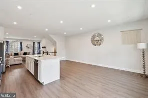 a view of kitchen with cabinets and wooden floor