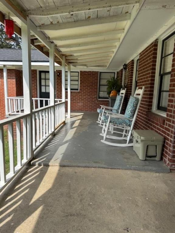 160 Tate Road Cedartown, GA 30125 - Photo 22 of 23 a view of a patio with table and chairs and wooden floor