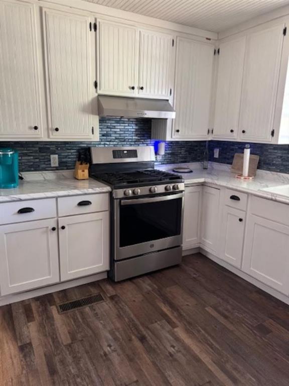 160 Tate Road Cedartown, GA 30125 - Photo 6 of 23 a kitchen with granite countertop white cabinets and appliances