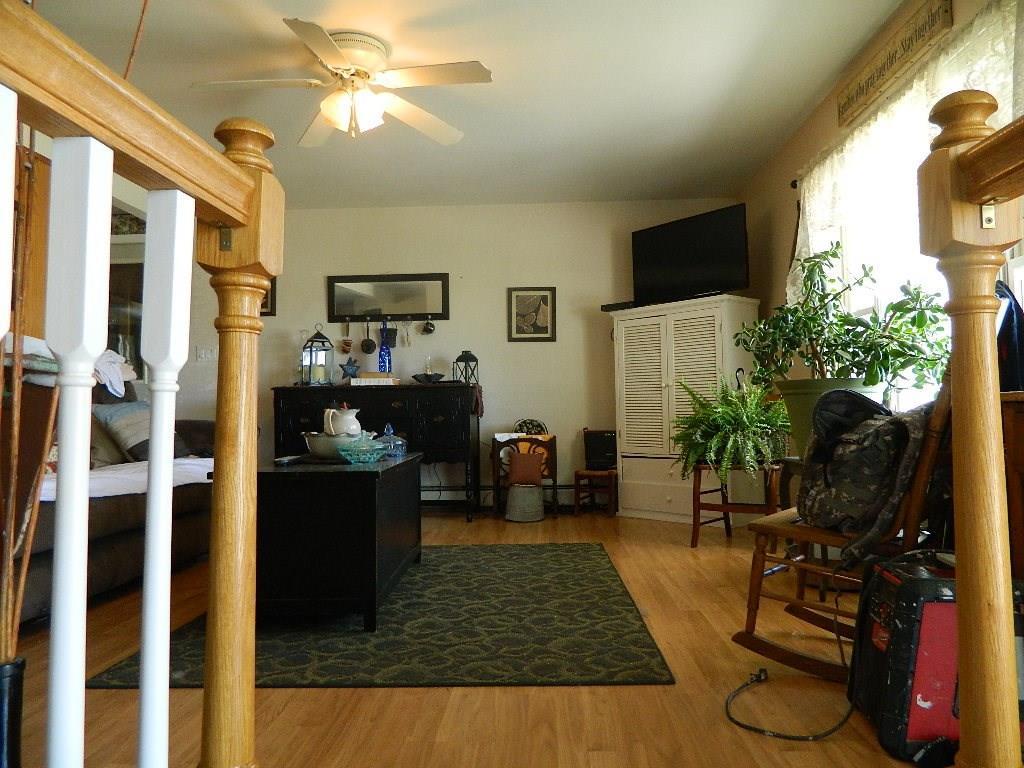 402 High Street Paris, ME 04281 - Photo 21 of 22 Stairs in living room lead down to...