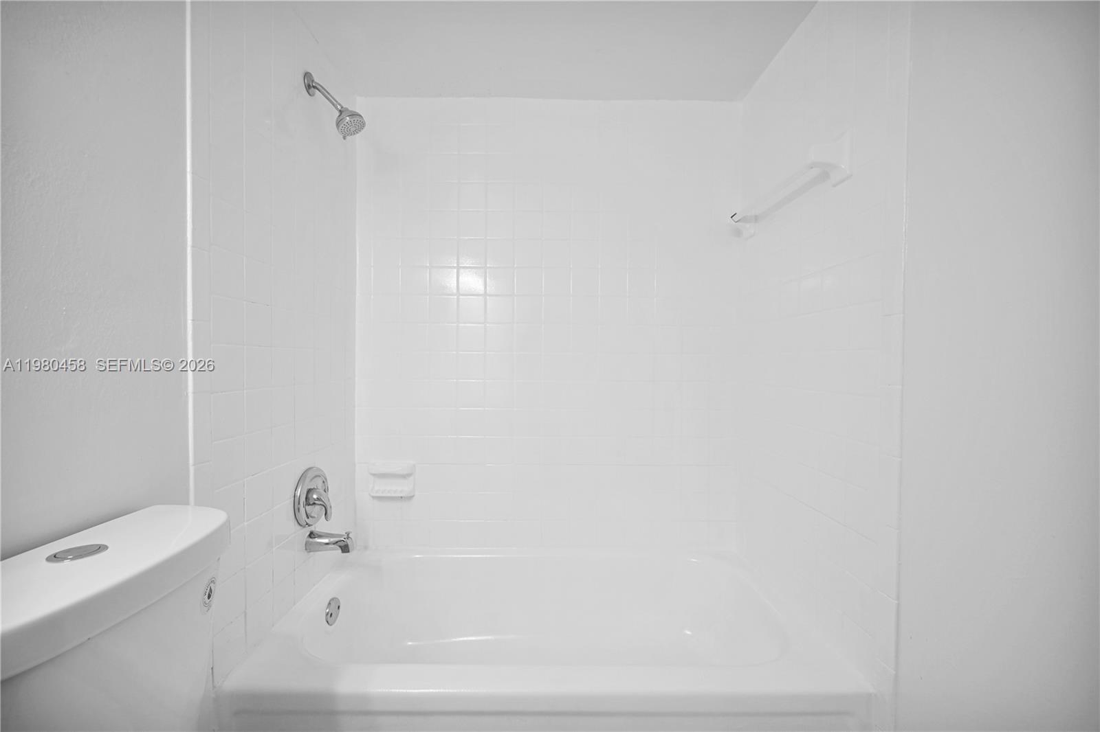 7550 Stirling Road, Unit C403 Davie, FL 33024 - Photo 21 of 27 a bathroom with a bathtub