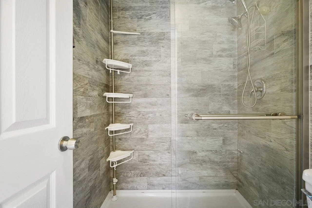 231 Blossom Way Oceanside, CA 92058 - Photo 18 of 31 a bathroom with a shower and toilet