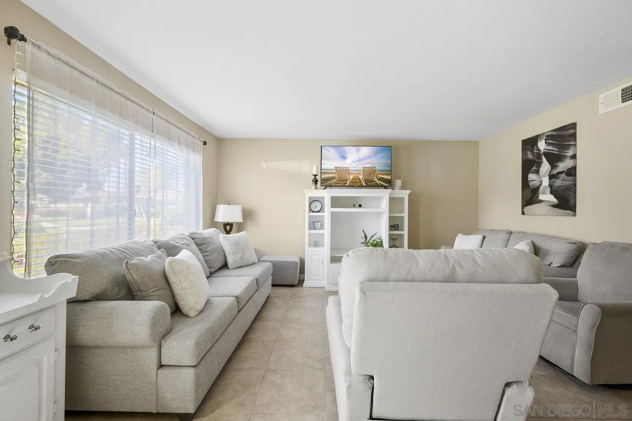 231 Blossom Way Oceanside, CA 92058 - Photo 3 of 31 a living room with furniture and a flat screen tv